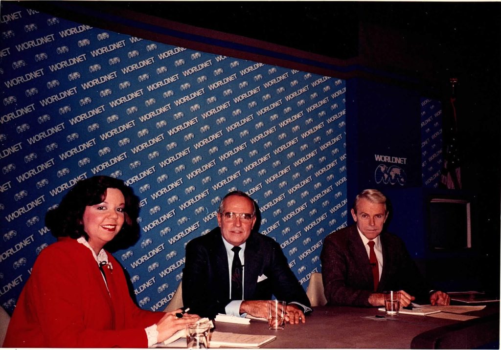 three people seated at a table