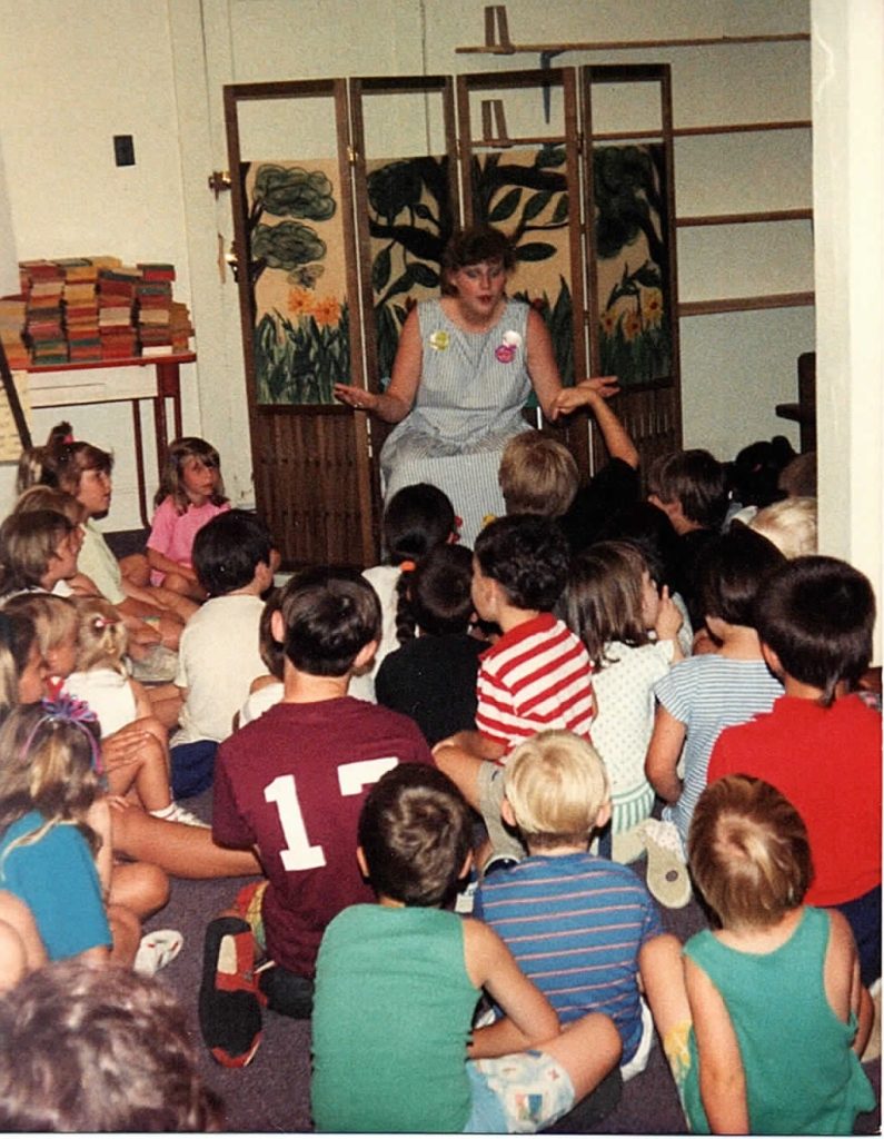 children listening to a story time at the library