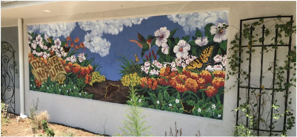 mural of pollinator plants and pollinators, hummingbird and butterfly