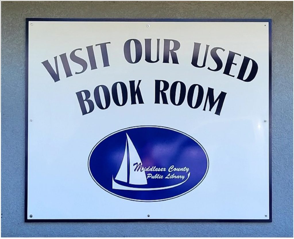 Visit our used book room sign